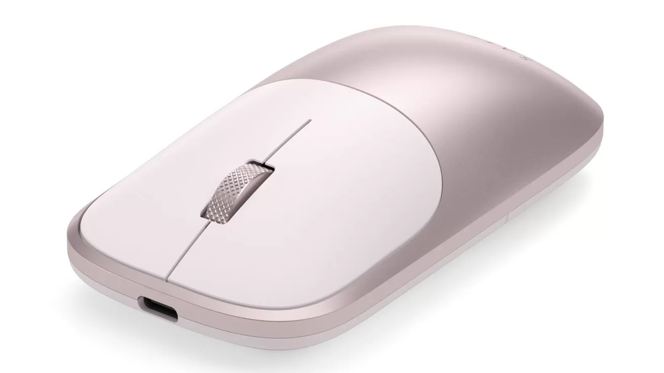 Sleek, rose-gold wireless computer mouse with a low-profile design, central scroll wheel, and front USB-C charging port, shown on a plain white background