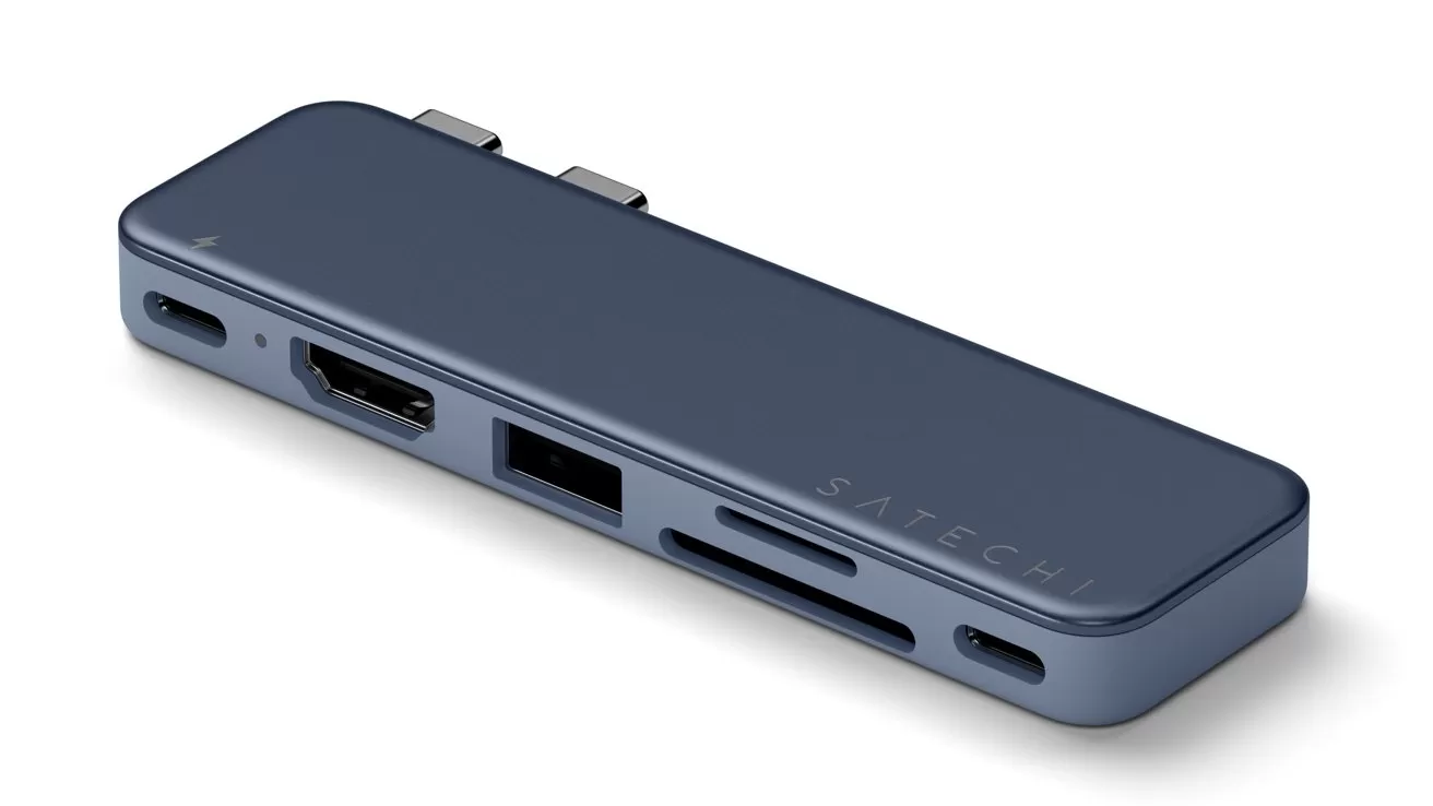 Slim dark-blue USB-C hub with multiple ports including HDMI, USB-A, SD and microSD card slots, designed to plug into the side of a laptop via dual USB-C connectors
