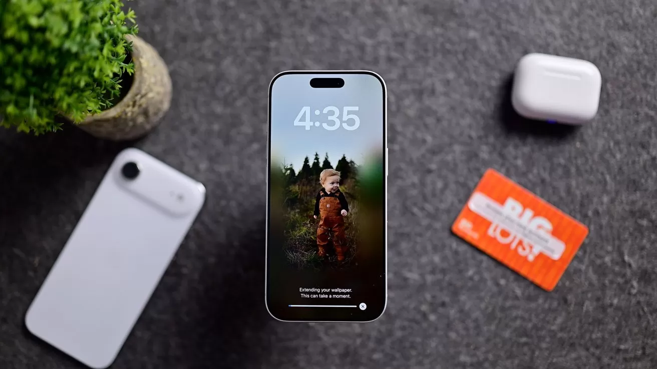 Smartphone displaying a child's photo and 4:35 time, centered on gray surface, surrounded by potted plant, white smartphone, wireless earbuds case, and red Big Lots gift card
